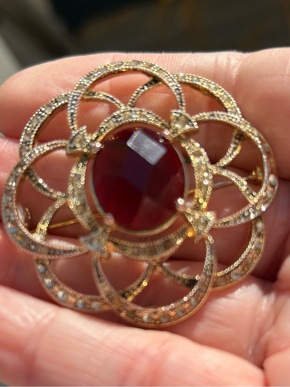 Vintage GoldTone Monet filigree brooch faceted red centre stone